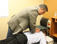 chiropractor treating patient